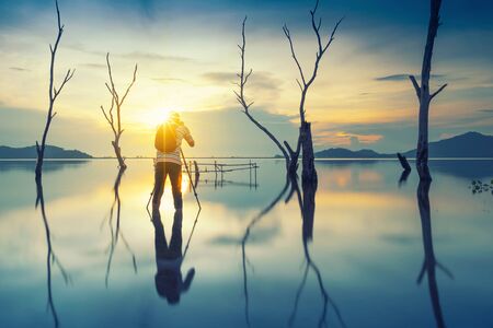 Silhouette of a photographer like to travel and photographyの写真素材