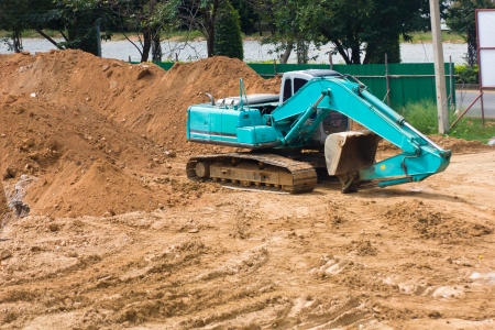 Big excavator on new construction siteの写真素材