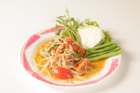 Thai papaya salad on a white backgroundの写真素材