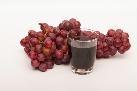 Red wine and grape juice Taken on a white backgroundの写真素材