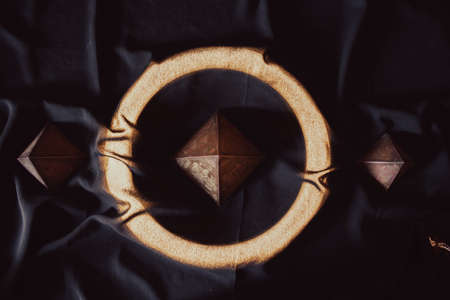 top view of a souvenir pyramid of giza surrounded by neon in goldenの写真素材