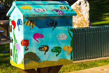Bird House With Children's Handprints In Various Colorsの写真素材