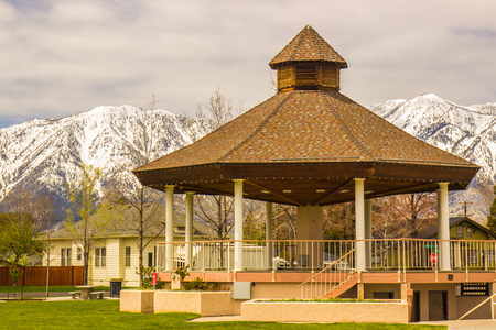 Gazebo In Public Park With Snow Covered Mountains In Backgroundの写真素材