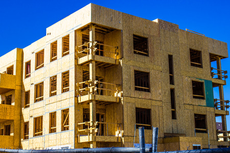 Brand New Construction Of Three Story Building With Balconies