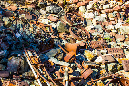 Pile Of A Variety Of Iron Wheels & Parts In Salvage Yardの写真素材