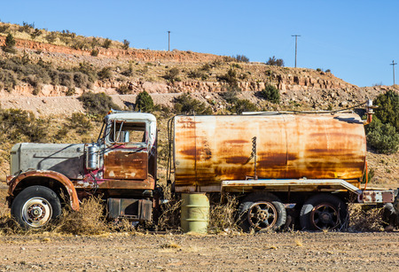 Vintage Rusted Water Tanker Truck In Salvage Yardの写真素材