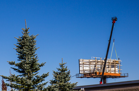 New Billboard Being Constructed With Craneの写真素材