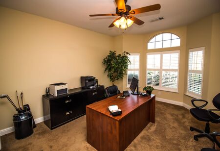 Office With Wooden Desk, Black File Cabinets & Office Equipment