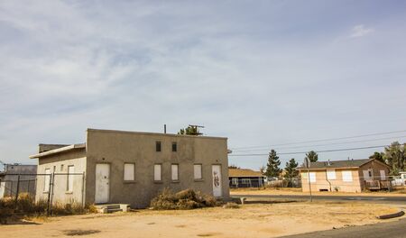 Two Abandoned Homes With Boarded Up Windowsの写真素材