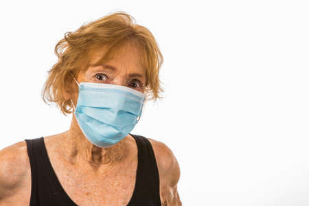 Frail Senior Woman Wearing Surgical Face Mask During Corona Virus Epidemicの写真素材