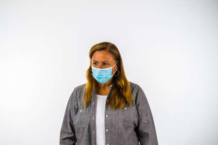 Mother Wearing Face Mask Looks Away Suspiciously During Corona Virus Epidemic