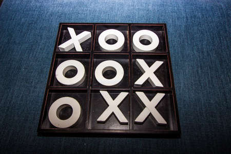 Large Decorative Tic-Tac-Toe Game Board Against Blue Denim Backgroundの写真素材