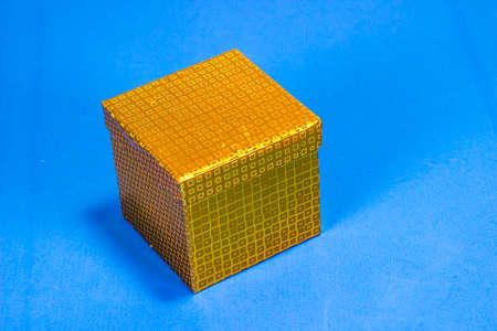 Small Gift Box With Lid On Blue Backgroundの写真素材
