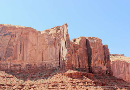 Sheer Cliffs Of Rock Outcropping In Monument Valley, Utshの写真素材