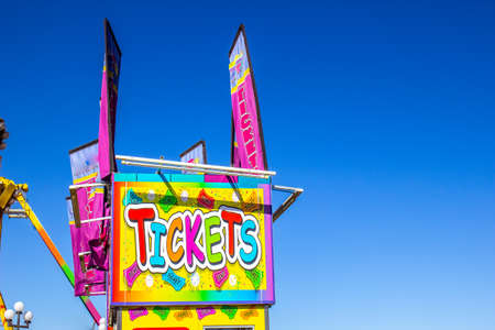 Colorful Ticket Booth With Banners At Local County Fair