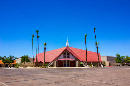 Modern Church Framed By Tall Palm Trees