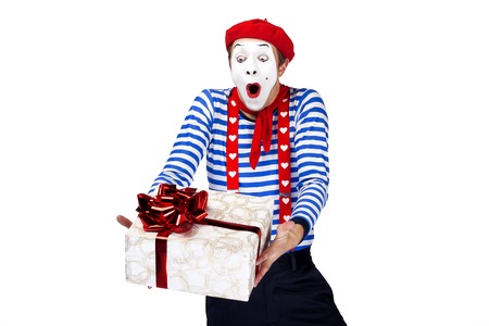 Mime with gift.Emotional funny actor wearing sailor suit, red beretの写真素材