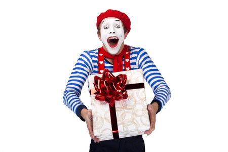 Mime with gift.Emotional funny actor wearing sailor suit, red beretの写真素材