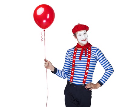 Mime with balloon.Emotional funny actor wearing sailor suit, red beretの写真素材