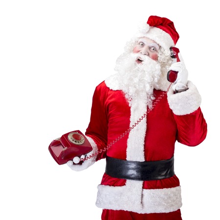 Santa Claus with red telephone posing on white backgroundの写真素材