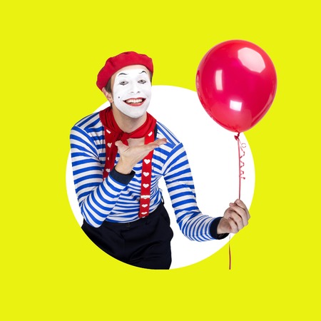 Mime with balloon.Emotional funny actor wearing sailor suit, red beretの写真素材