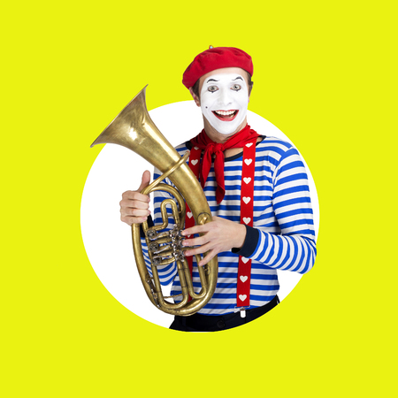 Mime with trombone.Emotional funny actor wearing sailor suit, red beretの写真素材