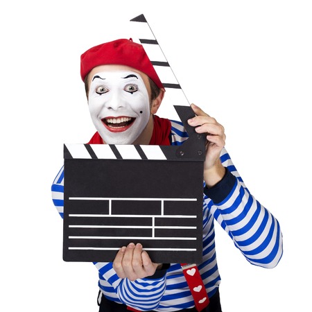 Emotional funny mime actor wearing sailor suit, red beret posing on white backgroundの写真素材