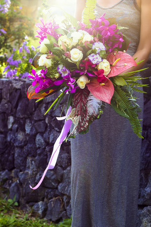 Bouquet of flowers in florist woman arms. Phuket, Thailandの写真素材