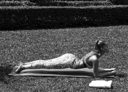 Yoga woman poses in tropics wearing stylish sportswear. Phuket, Thailandの写真素材