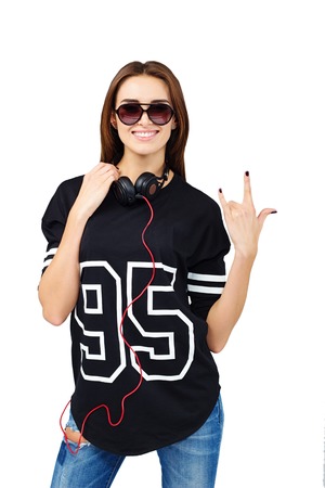DJ with earphones in jeans and black shirtの写真素材