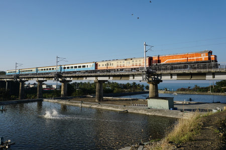 Train on the bridge over the river.