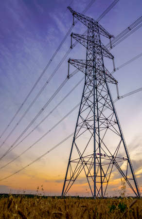 High-voltage iron tower in the sunsetの写真素材