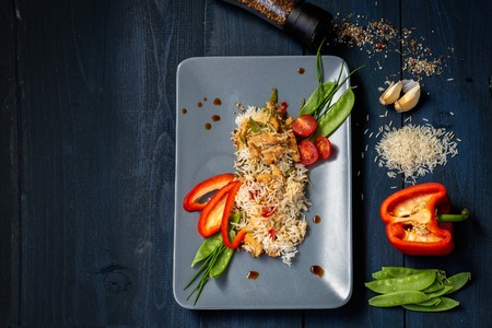 Thai Wok with chicken and rice and vegetablesの写真素材
