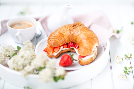 Morning background . Breakfast with coffee and croissants. light keyの写真素材