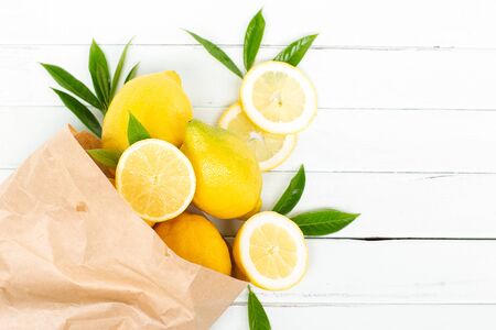 Lemons in a paper bag on a light background.の写真素材