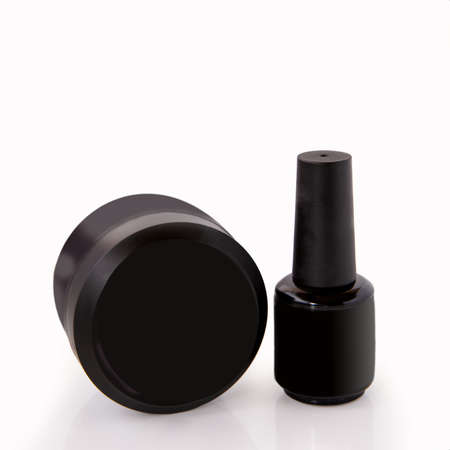 Cosmetics for hand care. Nail plate coating in black doses on a white backgroundの写真素材