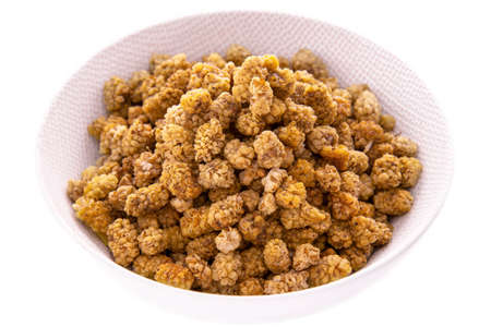 Dried fruits and freeze-dried berries.Dry mulberry is a white dish on a white background.Isolated products and itemsの写真素材