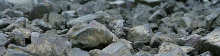 Large stones on the bank by the riverの写真素材