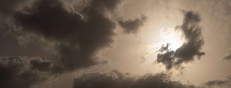 A few clouds and the sunの写真素材