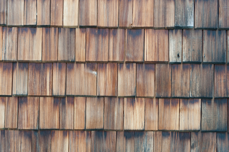 Brown wooden shingles on a wallの写真素材