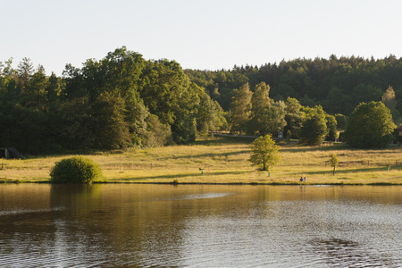 Quiet szene with a bathing lakeの写真素材