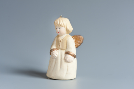 Christmas angel decoration with golden wingsの写真素材
