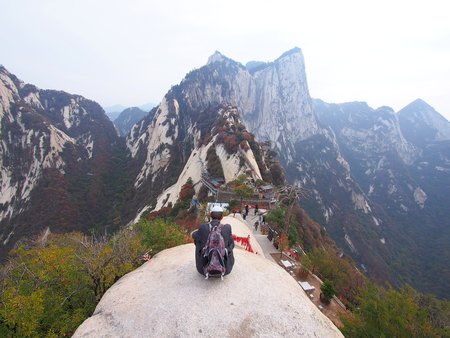old Guy and a Stunning View from the Peak of Huashan Mountain. Xian, China - October 18th, 2013のeditorial素材