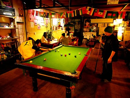 Hostel Life in Chengdu. Good traveler life. Snooker, Pool, Sit and Drink.Chengdu , Sichuan, China - October 15th, 2013のeditorial素材