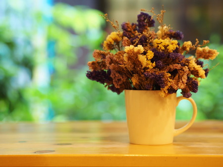 Dry Flower with a cup , vast , pot. on the wooden table, minimal styleの写真素材