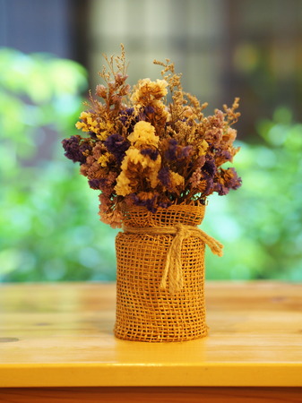 Dry Flower with a cup , vast , pot. on the wooden table, minimal styleの写真素材