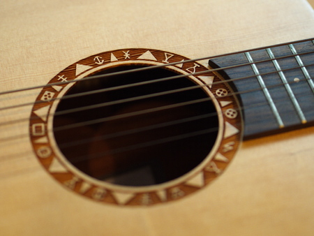 a Closeup Classic and Folk Guitar. Beautiful Background.の写真素材