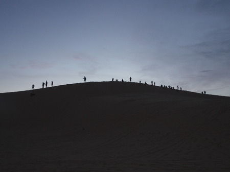 Silhouette Style Sunrise at the Big Sand Dune in Mui Ne City, Travel in Vietnam in 2012 December 7thの写真素材