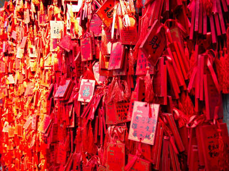 Red lucky charms hanging in Confucius temple in Longmen Grottoes World Heritage Site in Luoyang...