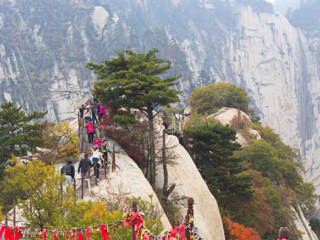Huashan Mountain near Xian City. The Most dangerous Trail and Crowned People in China. Mount Hua is one of the Five Great Mountains of China in Huayin City, Shaanxi Province, China, 18th October 2018.のeditorial素材